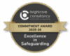 A circular badge with a gold ribbon reads: brightcore consultancy mental health & safeguarding, Commitment Award 2025-26, Excellence in Safeguarding.